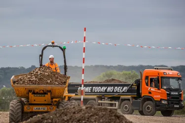 B&A truck behind man on machinery