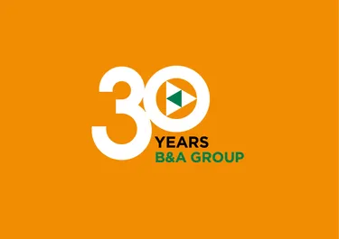 b and a 30th anniversary logo