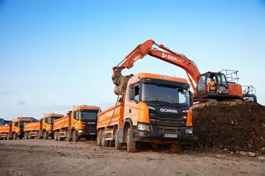 Tipper trucks being loaded