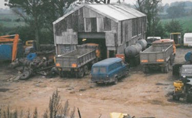 Old image of the B&A yard with old vehicles
