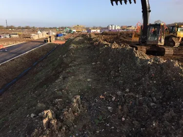 digger working on side of a road