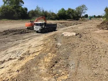 digger loading a tipper lorry