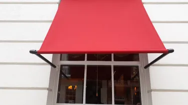 Drop arm awning Albermarle Street