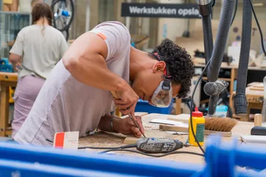 Student uses a chisel to make marks in MEDITE TRICOYA EXTREME