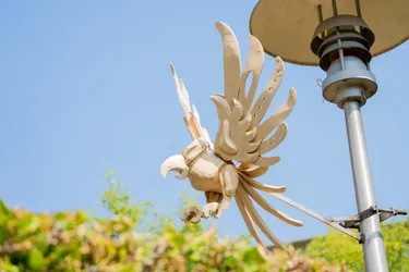 Bird lamp post sculpture