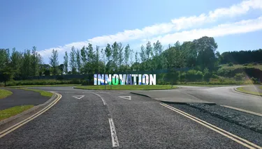 Road with Innovation sign on a roundabout