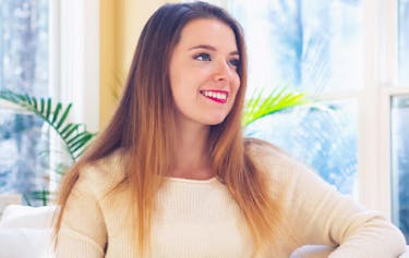 Image of a happy lady in her home